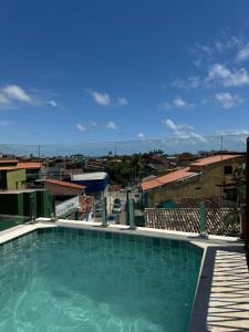 a large swimming pool on top of a building at Casa João de Barro in Itacaré