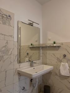 a white bathroom with a sink and a mirror at Seoski turizam Jagodić in Gorjani +32 photos