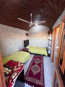 Postel nebo postele na pokoji v ubytování Hashem Nubian Guest House