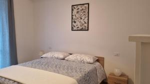 Postel nebo postele na pokoji v ubytování La Piccola Dimora Nel Borgo