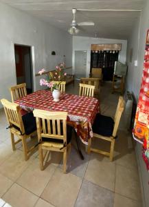 a dining room with a table and some chairs and a table and chairsktop at La Mericia in Villa Carlos Paz +6 photos