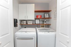 a laundry room with a washer and dryer at Sojourn Family Home Sleeps 6 in Norfolk