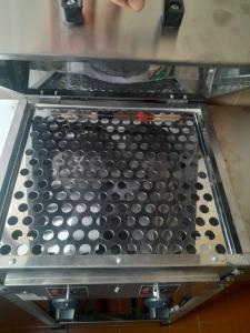 a machine with a metal tray on top of it at Apartamento Praia Grande in Ubatuba +30 photos