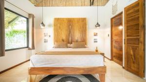 Postel nebo postele na pokoji v ubytování LA QUEBRADA ECO LODGE Hotel Boutique