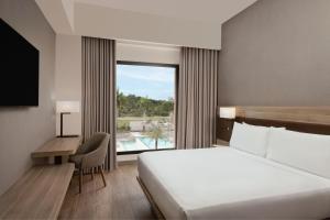 Voodi või voodid majutusasutuse AC Hotel by Marriott Punta Cana toas