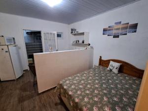 Ένα ή περισσότερα κρεβάτια σε δωμάτιο στο Apartamento 1 dormitório Rio vermelho