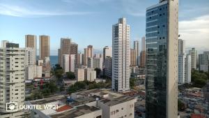 an aerial view of a city with tall buildings at Cobertura Duplex Vista do Mar in Recife