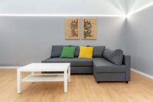 a living room with a couch and a coffee table at Elephant and Castle - Exclusive Holiday Home in Catania