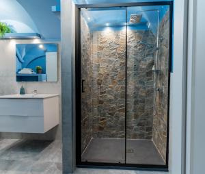 a shower with a glass door in a bathroom at Elephant and Castle - Exclusive Holiday Home in Catania