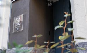a door with a sign on the side of a building at Elephant and Castle - Exclusive Holiday Home in Catania