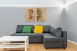 a living room with a couch and a table at Elephant and Castle - Exclusive Holiday Home in Catania