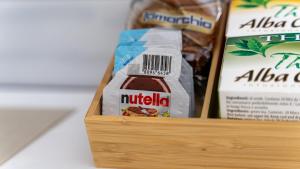 a wooden box with some food in it at Elephant and Castle - Exclusive Holiday Home in Catania