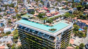 an aerial view of a building with a swimming pool at BEST Views of PV-Banderas Bay from Rooftop Infinity Pool in Puerto Vallarta