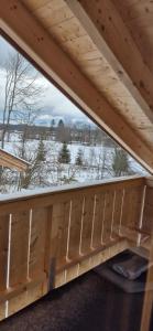 a view from the inside of a wooden building at Ferienwohnung SEElig in Fischbachau