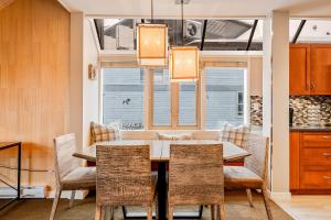 a dining room with a table and chairs at The Crest, Spacious, Central Condo, Free Parking in Whistler