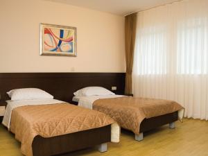 Postel nebo postele na pokoji v ubytování Hotel Orka