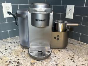a mixer sitting on top of a counter at Cozy 3BR Home Near ATL Airport in Fairburn +31 photos