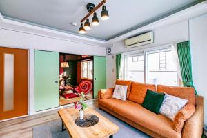 a living room with a couch and a table at THE SUNLIGHT in Sapporo
