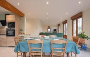 a kitchen and dining room with a table and chairs at 4 Bedroom Gorgeous Home In Valorbiquet in Saint-Julien-de-Mailloc