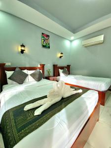 Postel nebo postele na pokoji v ubytování Phnom Tbeng Resort