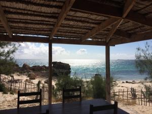 a view of the beach from a porch at Vazaha Vezo in Andavadoaka +15 photos