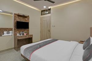Postel nebo postele na pokoji v ubytování Hotel O Kiwi International