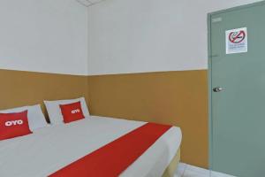 Postel nebo postele na pokoji v ubytování Meple Hotel Skudai