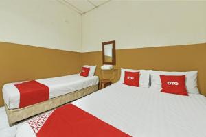 Postel nebo postele na pokoji v ubytování Meple Hotel Skudai