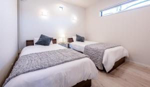 En eller flere senge i et værelse på Villa RIKUNOYA SUZUKA