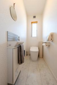 a bathroom with a sink and a toilet at Villa RIKUNOYA SUZUKA in Suzuka +30 photos