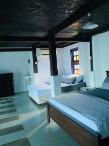 Ένα ή περισσότερα κρεβάτια σε δωμάτιο στο Sari Chempaka Home Stay