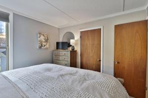 a bedroom with a bed and a dresser and a window at The Summit Suite at Whiffletree Vermont - Shuttle Bus, Pool, Summer Pool in Killington +23 photos