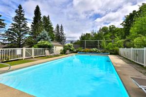 a large blue swimming pool in a yard at The Summit Suite at Whiffletree Vermont - Shuttle Bus, Pool, Summer Pool in Killington