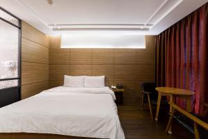 Browndot Hotel Incheon Songdo客房内的一张或多张床位