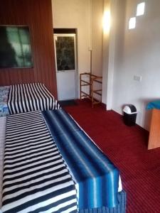 Postel nebo postele na pokoji v ubytování 4s Heaven