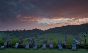 a group of chairs and tables on a field at Willa Wuja Sama in Zawóz +80 photos