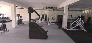 a gym with treadmills and machines in a room at Suite Privada en Coronado Luxury Club & Suites in Playa Coronado