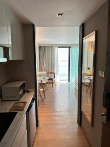 a room with a kitchen and a dining room at HomeAwayFromHome in Phuket