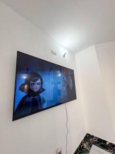 a flat screen tv hanging on a wall at White House villa in Malindi