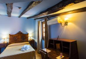 Postel nebo postele na pokoji v ubytování Hotel La Posada Regia
