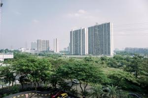 a view of a city with tall buildings at Wonderful 1BR Casa De Parco Apartment near ICE BSD By Travelio in Tangerang