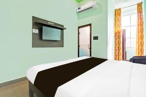 Hotel O Prakash Residency客房内的一张或多张床位