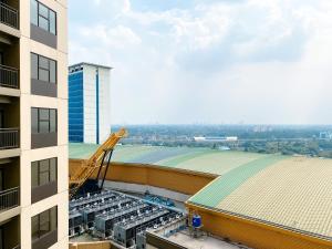 an overhead view of a building with a crane at Best Deal and Cozy Studio Room Transpark Cibubur Apartment By Travelio in Depok