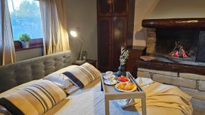 a bedroom with a bed with a table with food on it at Studio apartment Cami - Cottage with a soul in Gračišće +37 photos