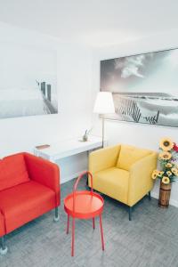 a living room with two chairs and a table at For family group, 4min to Seoul station in Seoul