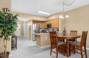 a kitchen and dining room with a table and chairs at The Legends in Myrtle Beach