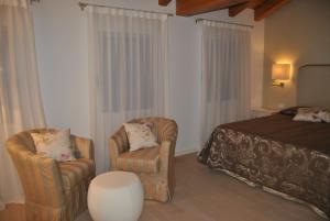 A bed or beds in a room at Agriturismo Ca' Beatrice - Venice Airport