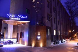 a building with a sign that reads justice place at night at Beijing Tiananmen Wangfujing Ruibeting Apartment Hotel in Beijing