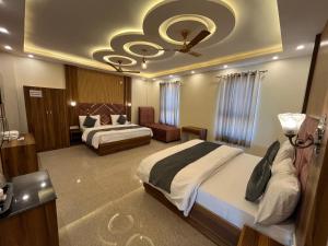 Voodi või voodid majutusasutuse Hotel Grand Safari toas