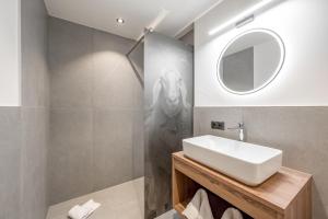 a bathroom with a sink and a mirror at Apart Natur in Sölden +44 photos